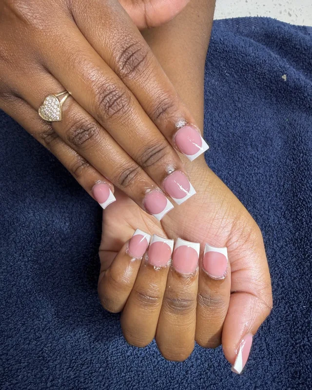 A fresh set of pink-and-white French square nails.